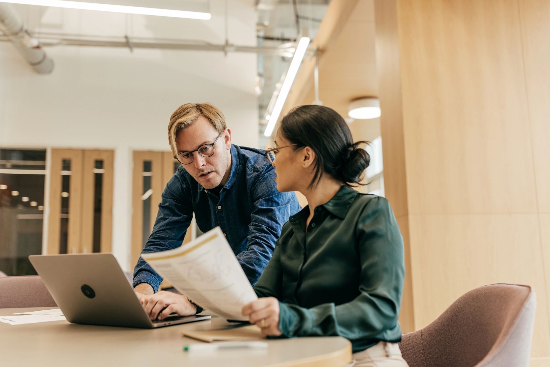 Team meeting in an office discussing next steps