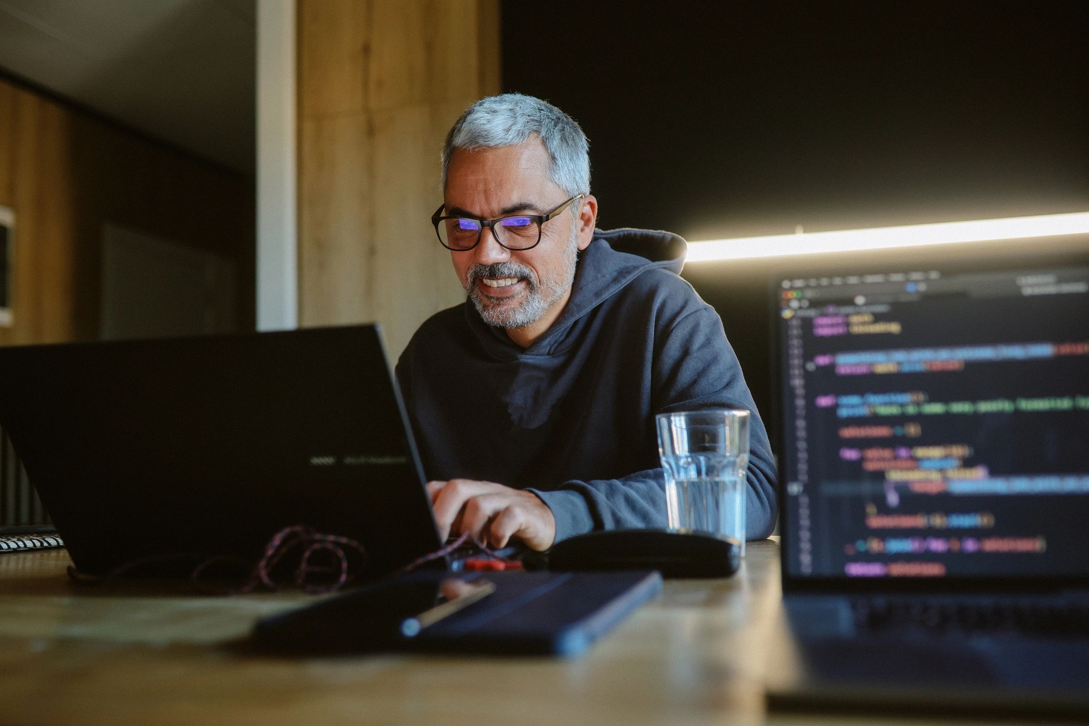 Consultant working on a laptop in a modern workspace